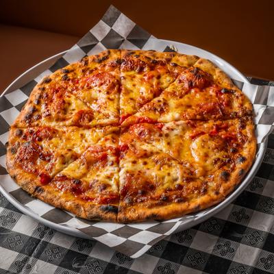 Grampa Scott's Hot Pepperoni  Pizza served on a tray lined with checkered paper.