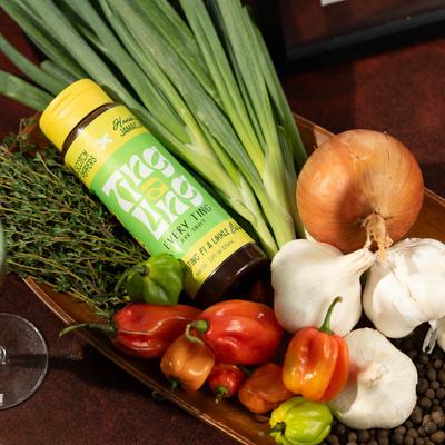 Jerk sauce on a plate with fresh vegetables.