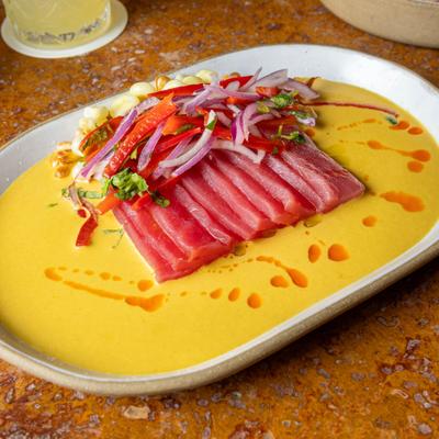 Thinly sliced raw tuna with vegetables.