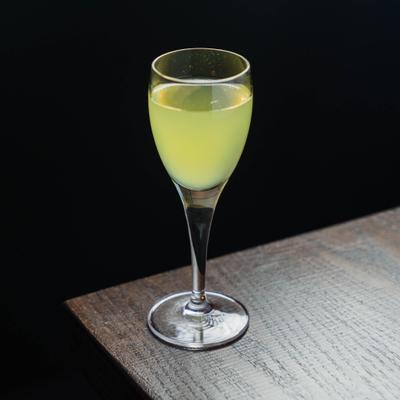 Limoncello served in a small stemmed glass.