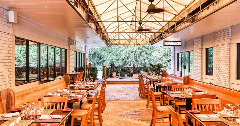 Covered patio with tables and chairs