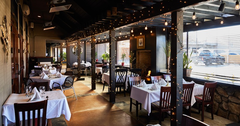 Nicely done interior dining area with set tables ready for guests