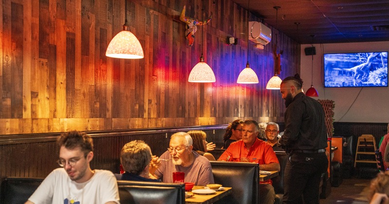 Interior space, dining area, guests enjoying their food and drinks
