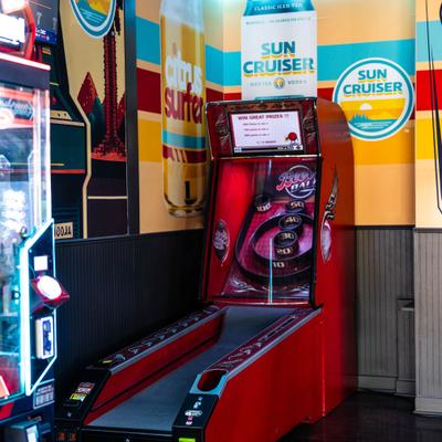 Arcade game machine in the corner of the restaurant.