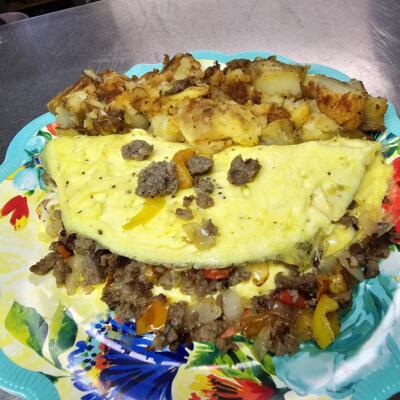 Country Sausage Omelet, served with hash browns.