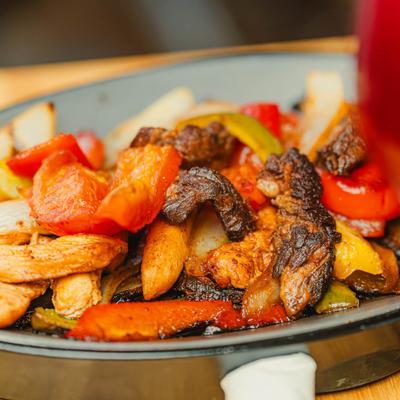 Close-up of steak and chicken fajitas.