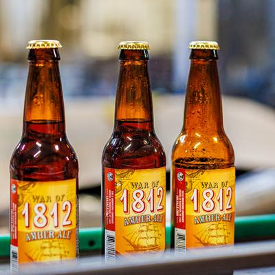 Three bottles of house-brewed beer.