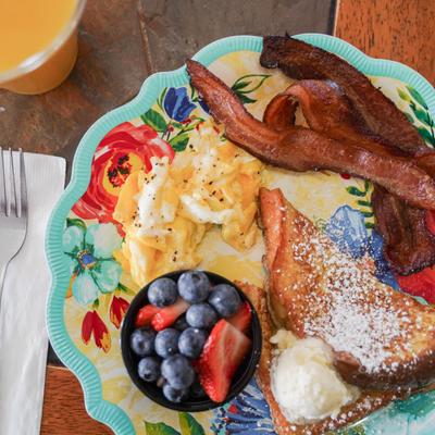 Kid's breaky plate and orange juice, top view.