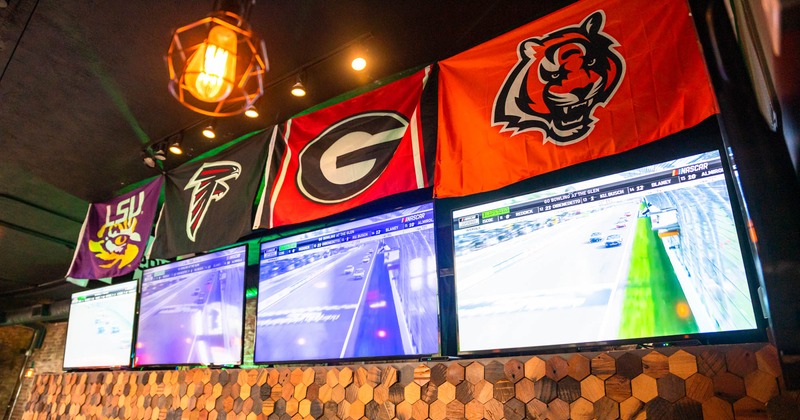 Back bar, sports banners above TV screens