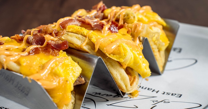 Breakfast tacos with eggs, melted cheese, and bacon