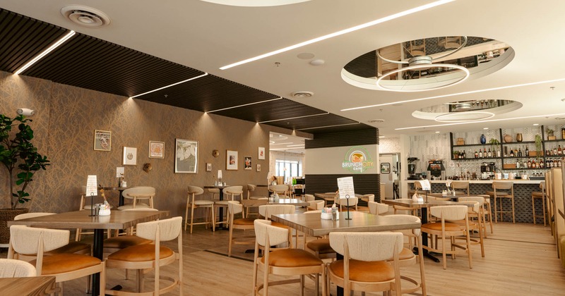 Interior, chairs and tables, bar area in the background