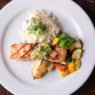 Grilled salmon, vegetables, and cilantro risotto.