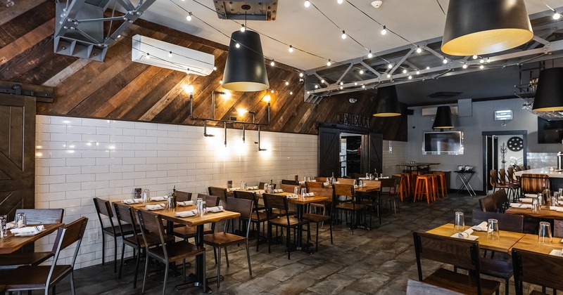 Restaurant interior, dining area with set dining tables