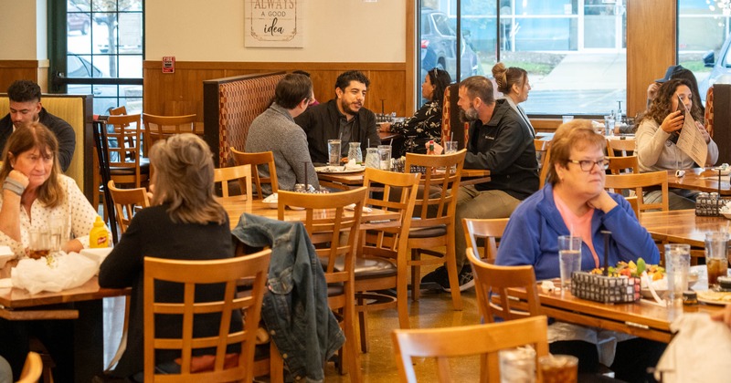Interior, diner area, tables, chairs, guests