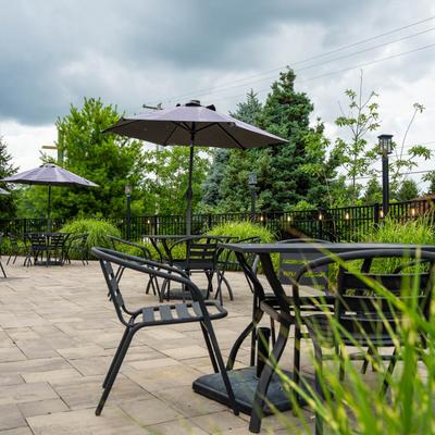 Tables and chairs outside on the patio.