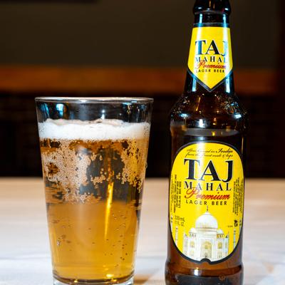 Glass and bottle of Taj Mahal Beer