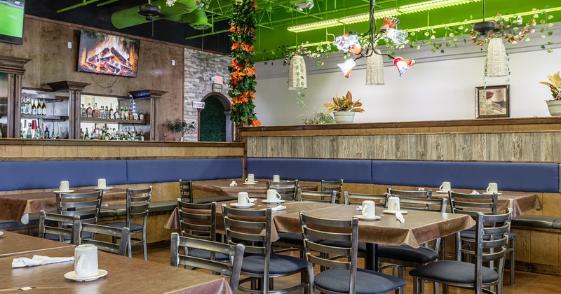 Interior space, dining area with set tables ready for guests