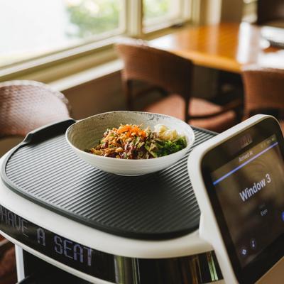 Restaurant robot delivering a bowl of food.