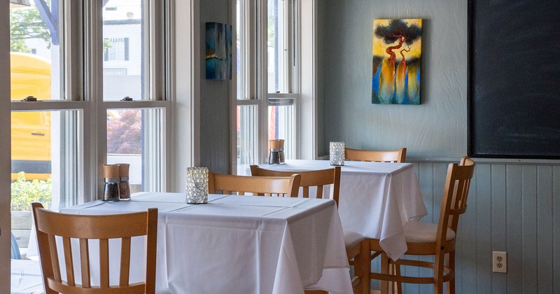 Restaurant interior, dining tables by the windows