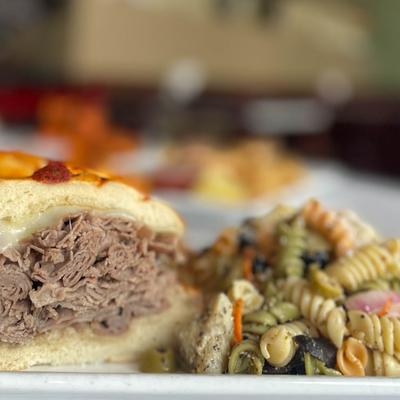 A served panini with pasta.