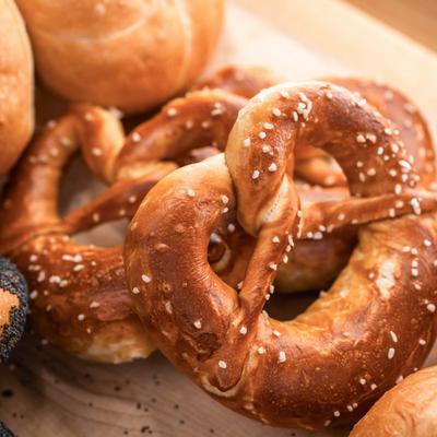 Assorted bread rolls and pretzels.