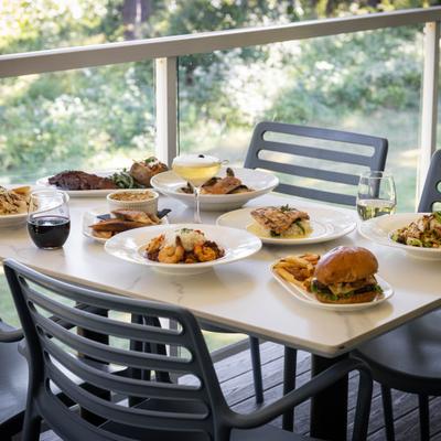 Various food and drinks on he table.