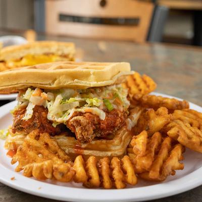 Buffalo chicken sandwich and waffle fries.