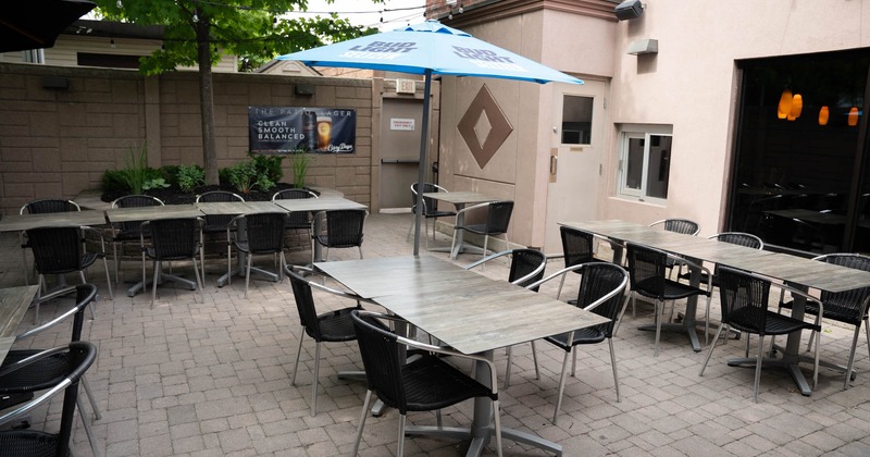 Exterior, patio seating area, tables and chairs