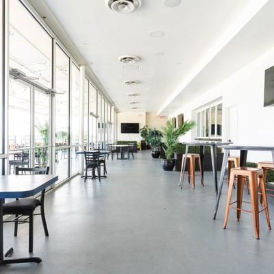 Rooftop interior, tables and chairs.