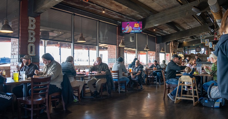 Interior, seating area, guests chatting and enjoying their food and drinks