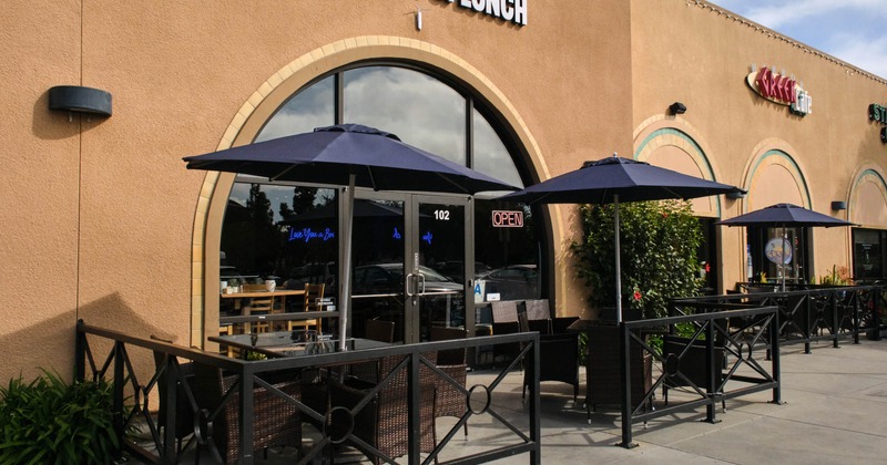 Exterior, tables with parasols and chairs