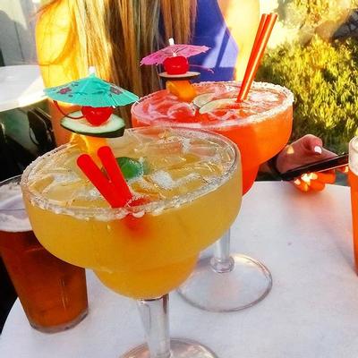 Two glasses of cocktails with decorations