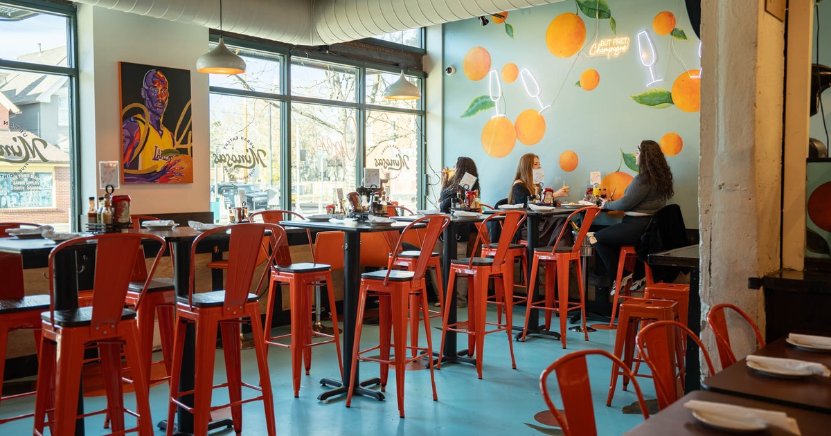 Interior, high tables and chairs ready for guests