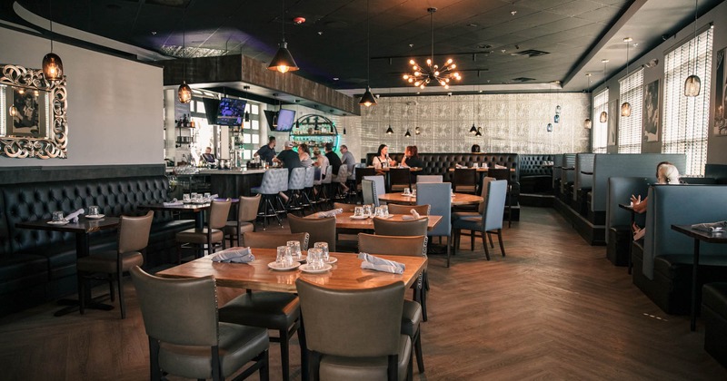 Dining area, guests seating at the bar