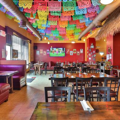 Interior, dining area, colorful hanging decorations.