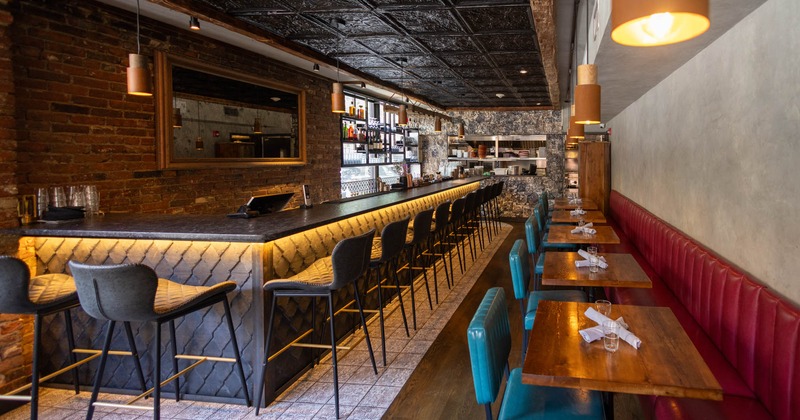 Interior, wide view of dining area, bar area on the left