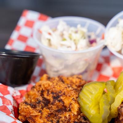 Leg and Thigh Combo with sides and dips, close-up.