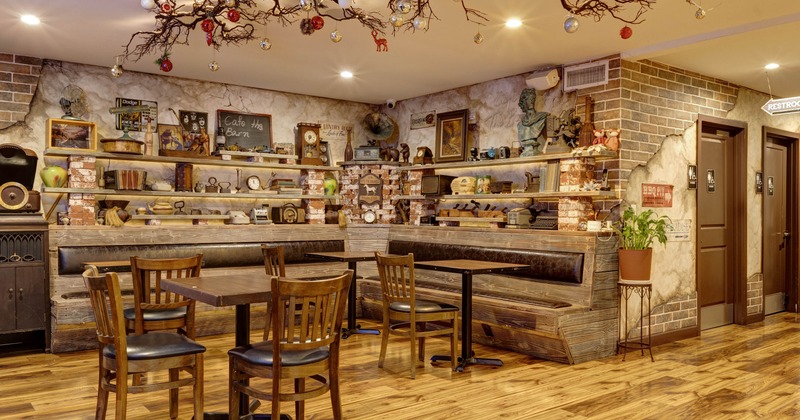 Interior, corner banquette bench with tables and chairs, regular table for two