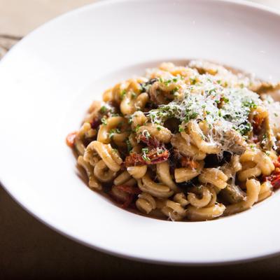 Pasta with mushrooms and grated cheese.