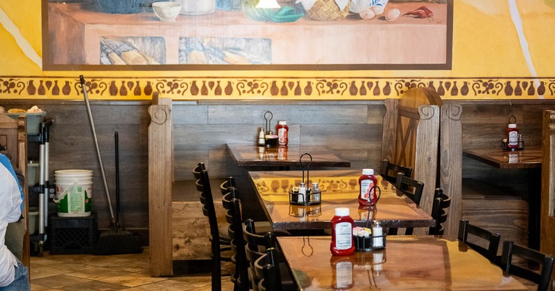 Interior, tables and chairs in dining area