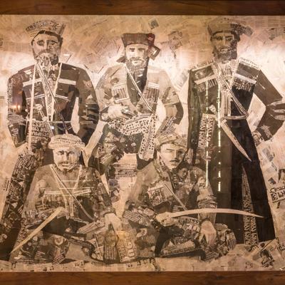 Georgian horsemen art piece collage on wall of Supra restaurant
