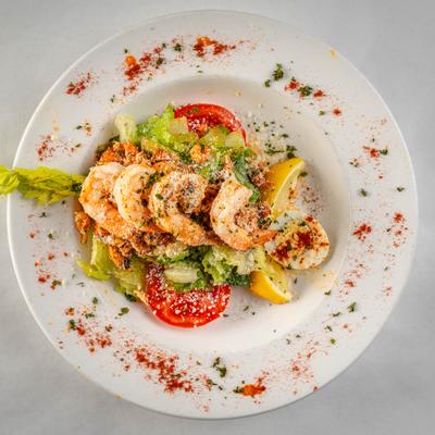 Chef Monte’s Cajun Salad topped with shrimp. top view.