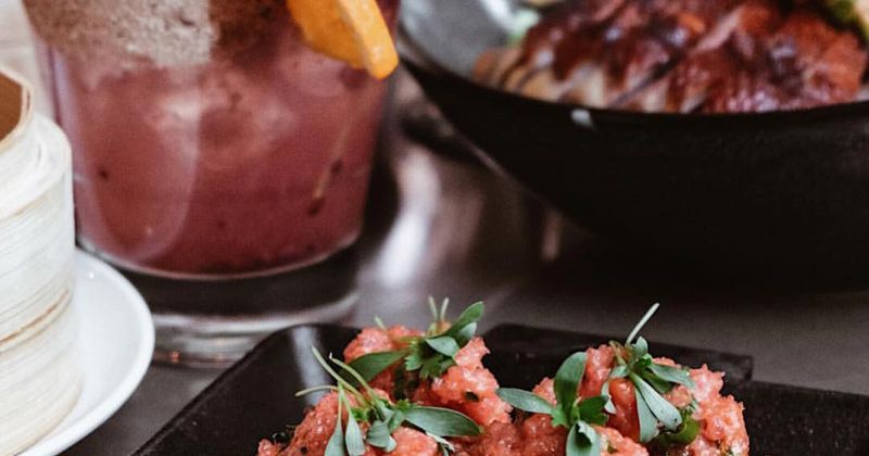 Small sandwiches, cocktail in the back