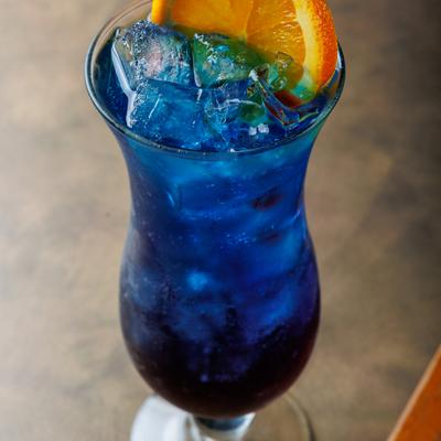 Blue cocktail on the rocks.