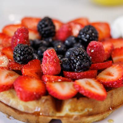 Waffles topped with fresh berries.