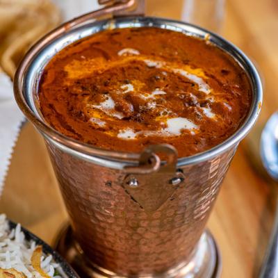 Slow cooked black lentils and red kidney beans with spices, butter and cream.