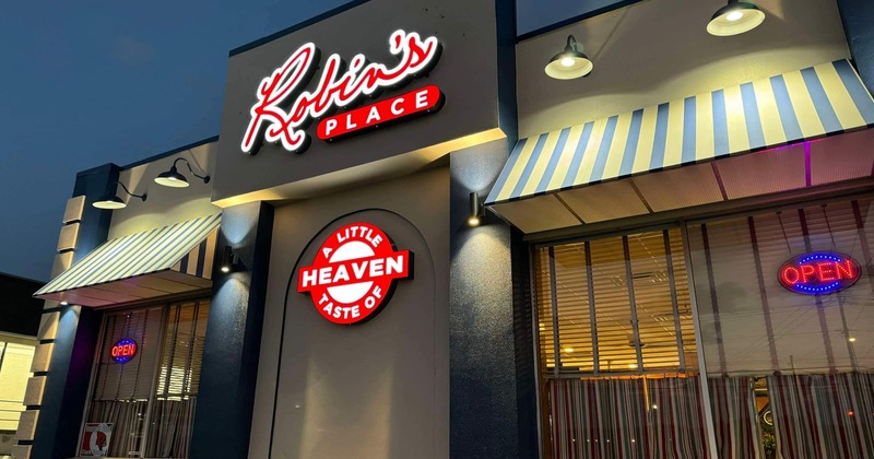 Exterior, front view to restaurant, light signs