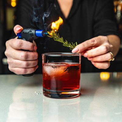 Hands preparing a drink.