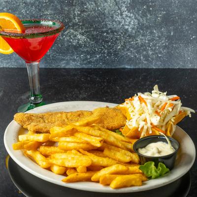 Fried catfish with fries, coleslaw, dipping sauce, and a cocktail.