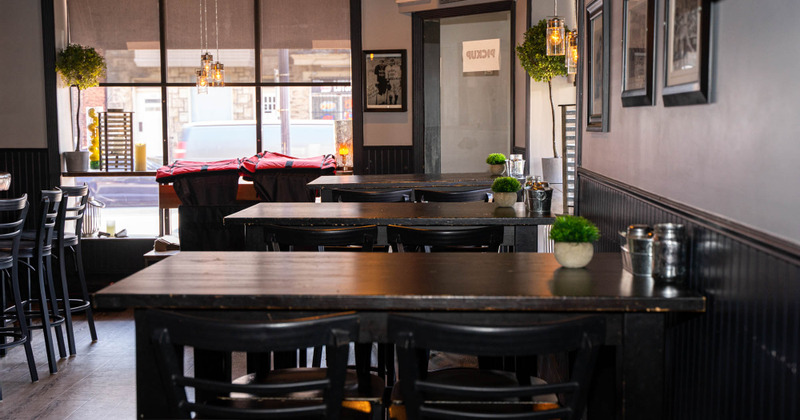 Interior - wooden tables and chairs, pictures on the walls